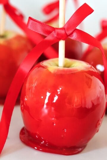Red candy apples on a white background.