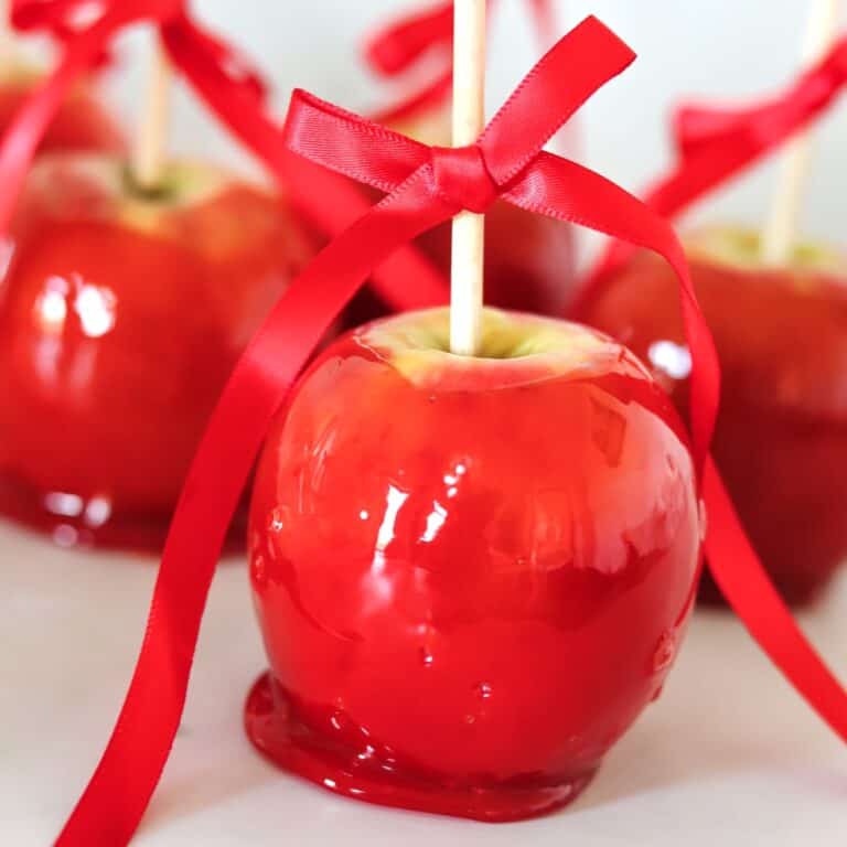 Red candy apples on a white background.